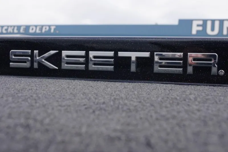 Slide: The Image of Close-up of 2019 Skeeter ZX250 logo on a textured surface. - 21
