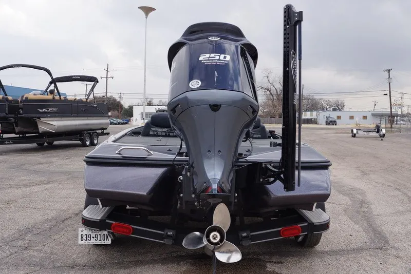 Slide: The Image of 2019 Skeeter ZX250 boat with powerful outboard motor, parked in a lot. - 4