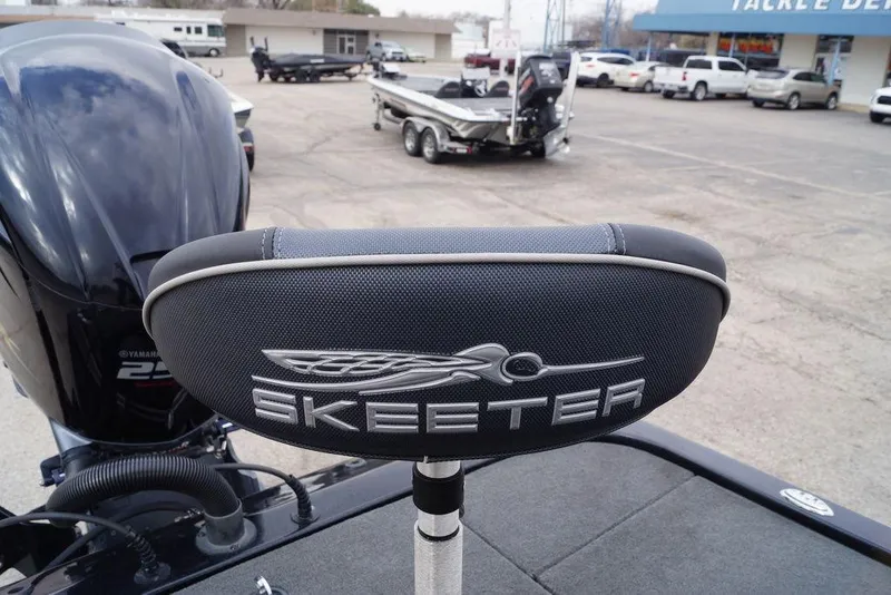 Slide: The Image of 2019 Skeeter ZX250 boat seat with logo, parked in a dealership lot. - 8