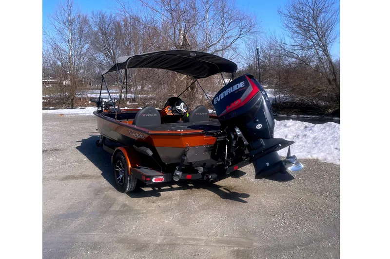 Slide: The Image of 2019 Vexus AVX1880 boat with Evinrude motor outdoors. - 2