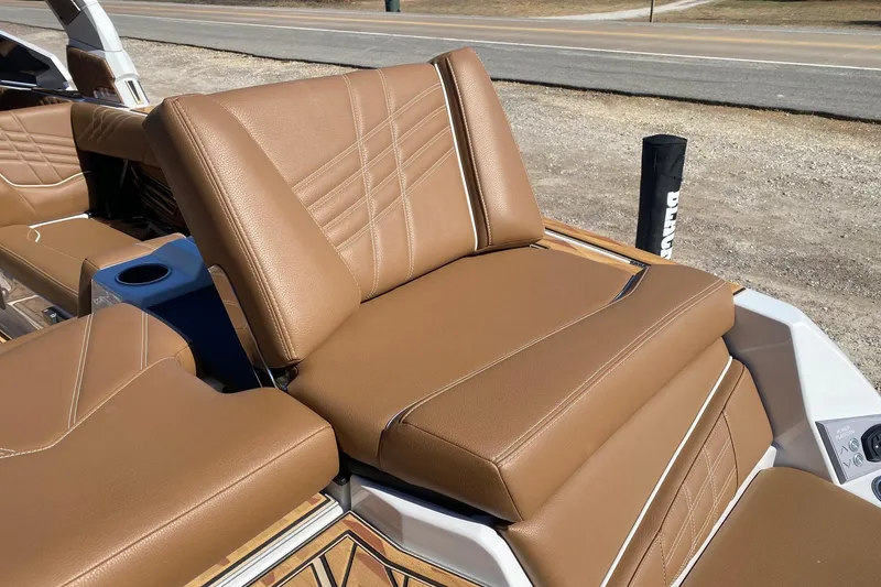 Slide: The Image of 2025 Tigé Ultré 25ZX boat with luxurious tan leather seating and modern design. - 5