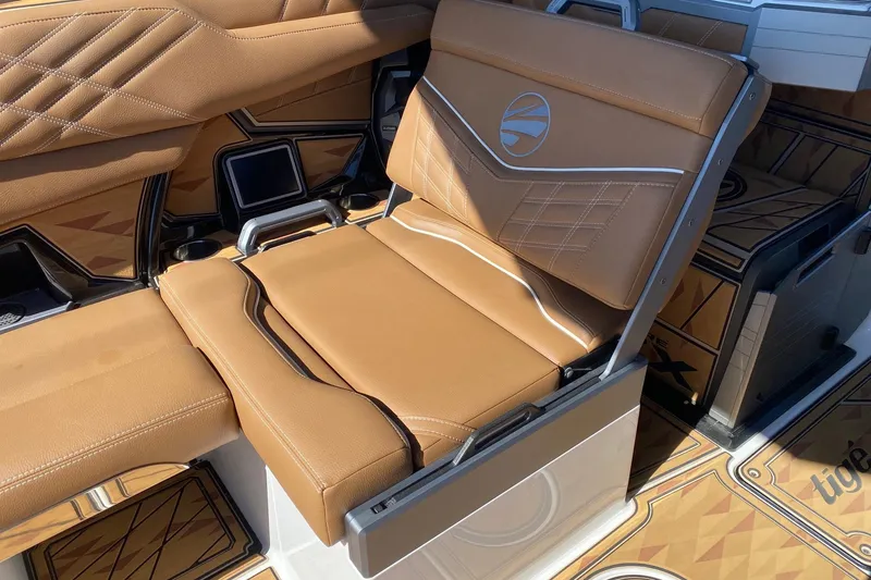 Slide: The Image of 2025 Tigé Ultré 25ZX boat interior with luxurious tan leather seating. - 8