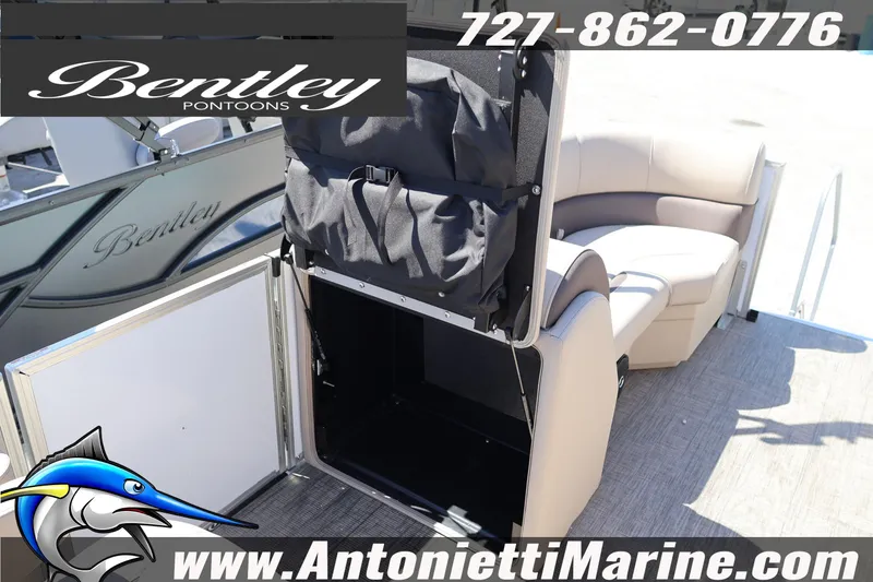 Slide: The Image of 2026 Bentley Pontoons Legacy 203 Swingback interior with storage compartment open. - 23