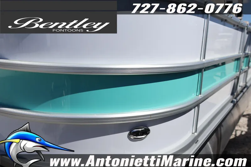 Slide: The Image of 2026 Bentley Pontoons Legacy 203 Swingback, sleek design with turquoise accents, Antonietti Marine branding. - 7