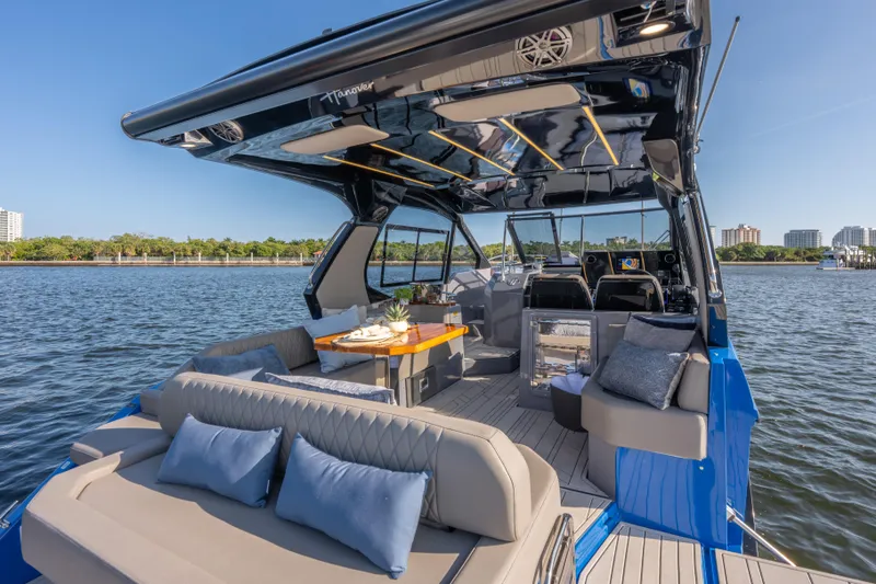 Slide: The Image of Luxurious 2026 Hanover 347 yacht interior with elegant seating and dining area on the water. - 15
