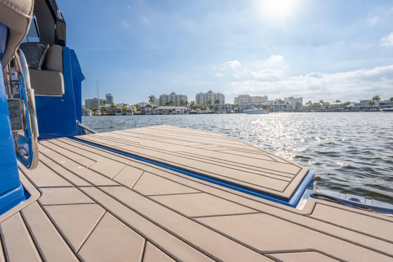 Slide: The Image of Luxury Hanover 347 boat deck overlooking sunny waterfront cityscape, 2026 model. - 25