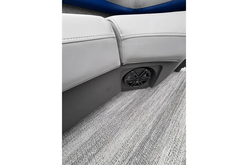 Slide: The Image of 2026 Bennington 22 M FASTBACK interior with speaker and gray upholstery. - 11