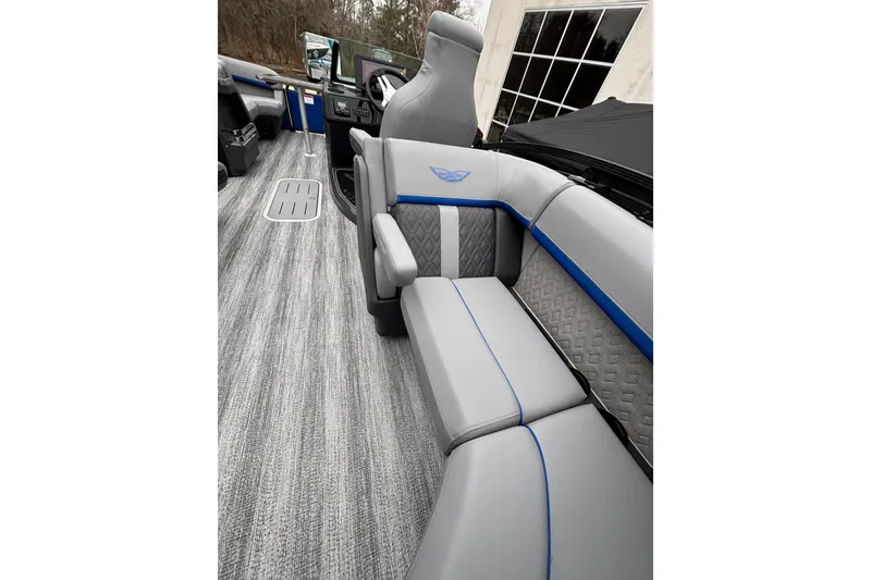 Slide: The Image of 2026 Bennington 22 M FASTBACK interior with gray and blue seating, modern design. - 13