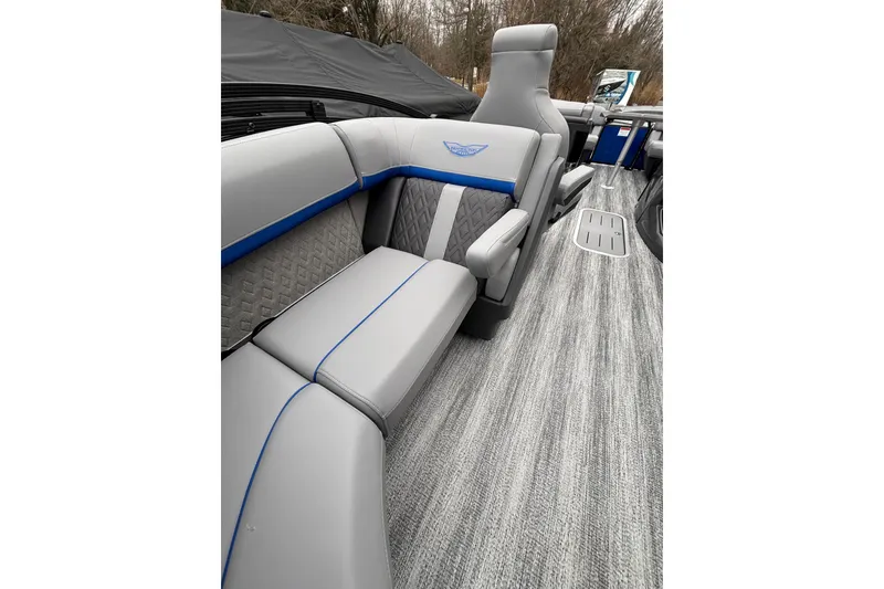 Slide: The Image of 2026 Bennington 22 M FASTBACK interior with gray and blue seating, modern design. - 14