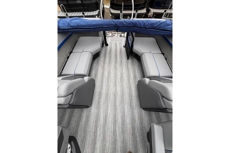 Slide: The Image of Interior of 2026 Bennington 22 M FASTBACK pontoon boat with gray seating and flooring. - 15