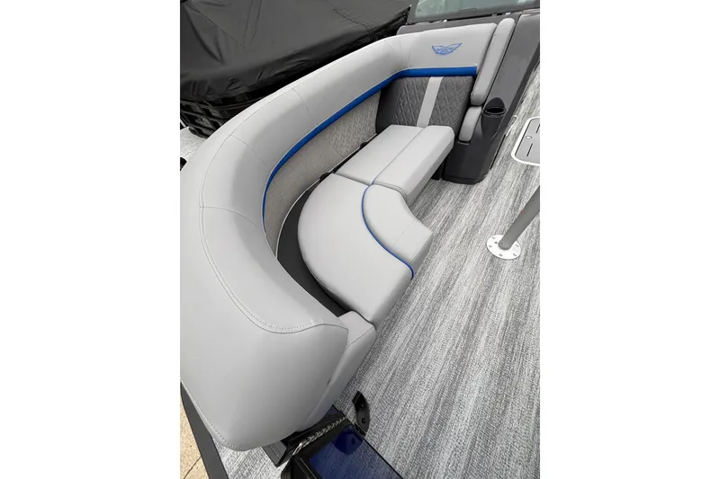 Slide: The Image of 2026 Bennington 22 M FASTBACK boat interior with gray and blue cushioned seating. - 3