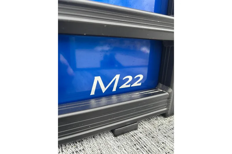 Slide: The Image of Close-up of 2026 Bennington 22 M FASTBACK boat with 'M22' marking. - 9