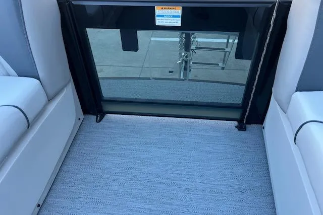 Slide: The Image of Interior view of 2026 Godfrey Sweetwater 2086 SB pontoon boat with seating and safety gate. - 10