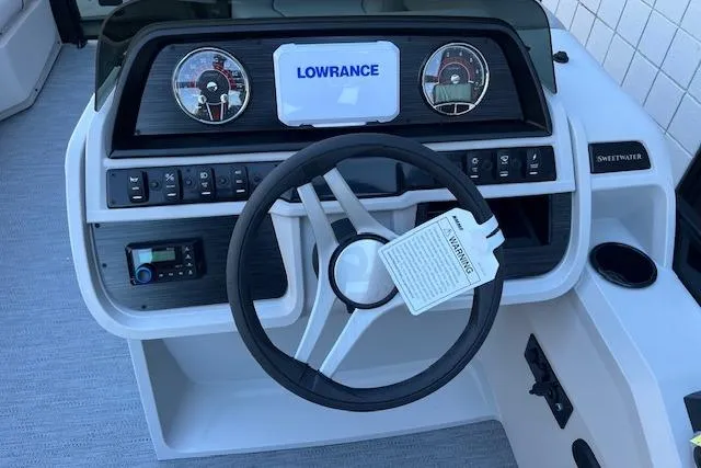 Slide: The Image of 2026 Godfrey Sweetwater 2086 SB dashboard with steering wheel and Lowrance display. - 11