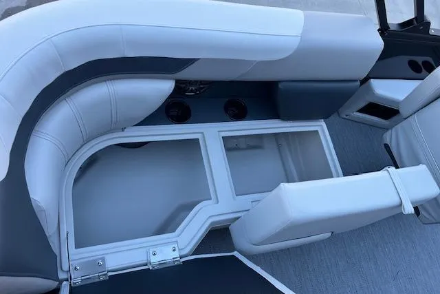 Slide: The Image of 2026 Godfrey Sweetwater 2086 SB boat interior seating with storage compartments. - 14