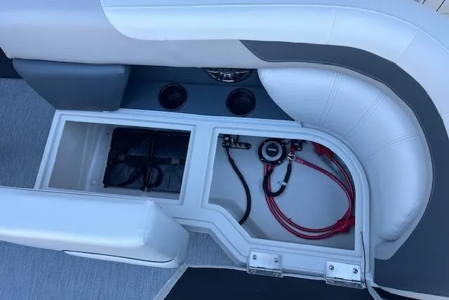 Slide: The Image of 2026 Godfrey Sweetwater 2086 SB boat storage compartment with wiring and seating. - 15