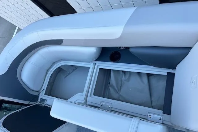 Slide: The Image of 2026 Godfrey Sweetwater 2086 SB boat interior with white and gray seating. - 19