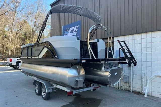 Slide: The Image of 2026 Godfrey Sweetwater 2086 SB pontoon boat on trailer, parked outdoors. - 3