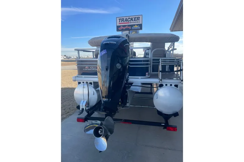 Slide: The Image of 2023 Sun Tracker Fishin' Barge 20 DLX pontoon boat with outboard motor. - 5