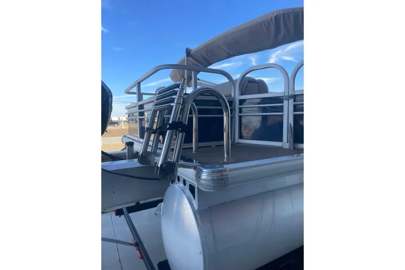 Slide: The Image of 2023 Sun Tracker Fishin' Barge 20 DLX pontoon boat with ladder and railing. - 6