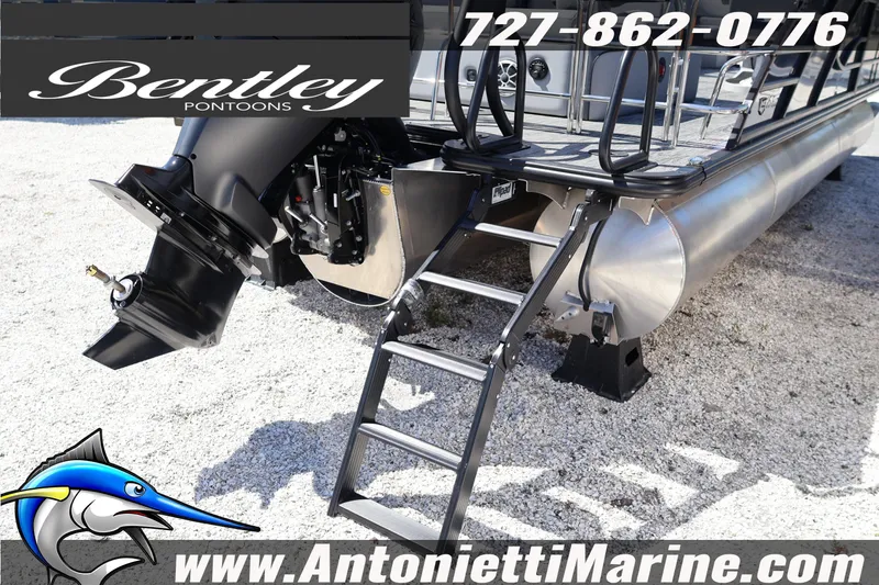 Slide: The Image of 2026 Bentley Pontoons Elite 253 Swingback with motor and ladder, displayed at Antonietti Marine. - 13