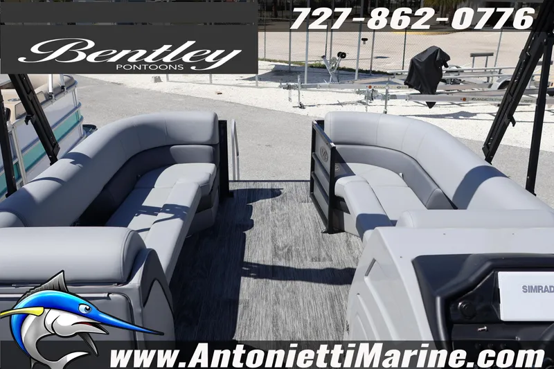 Slide: The Image of 2026 Bentley Pontoons Elite 253 Swingback interior with gray seating, displayed at Antonietti Marine. - 16