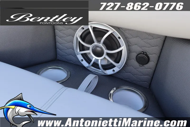 Slide: The Image of 2026 Bentley Pontoons Elite 253 Swingback interior with speaker and cup holders. - 20