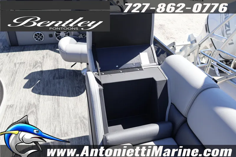 Slide: The Image of 2026 Bentley Pontoons Elite 253 Swingback interior with open storage compartment. - 21