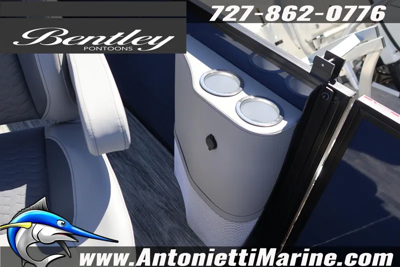 Slide: The Image of 2026 Bentley Pontoons Elite 253 Swingback interior with cup holders and seating. - 31