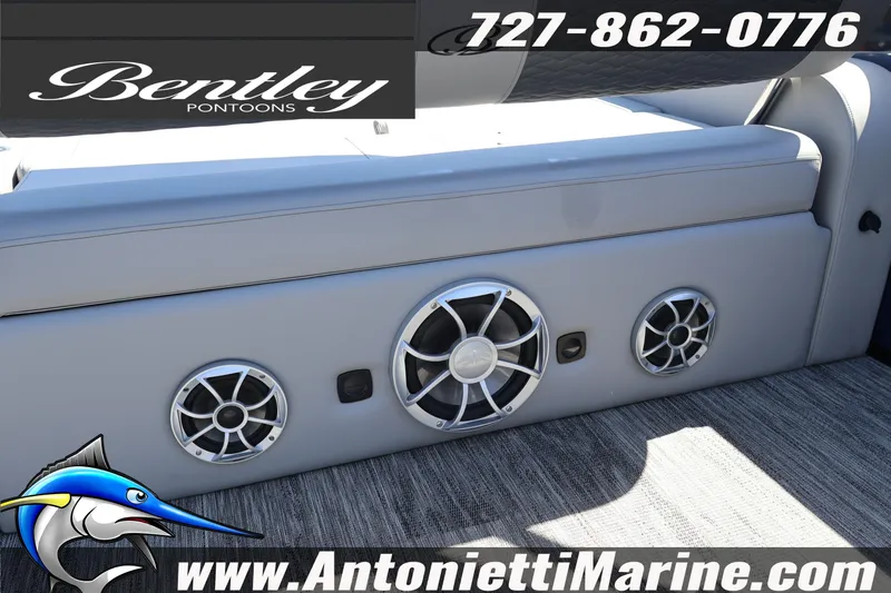 Slide: The Image of 2026 Bentley Pontoons Elite 253 Swingback interior with premium audio system and seating. - 32