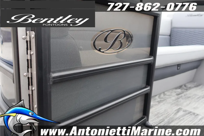 Slide: The Image of 2026 Bentley Pontoons Elite 253 Swingback interior with logo and contact details. - 4