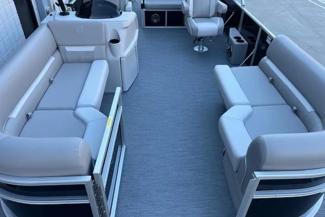 Slide: The Image of Luxurious 2026 Godfrey EX 2286 SFLX pontoon boat interior with plush seating. - 5