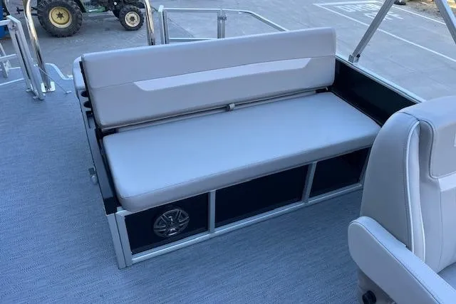 Slide: The Image of 2026 Godfrey EX 2286 SFLX boat interior with gray seating and storage compartments. - 7