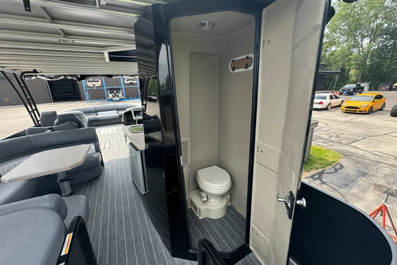 Slide: The Image of Luxurious 2026 Premier Escalante boat interior with seating, kitchenette, and bathroom. - 12