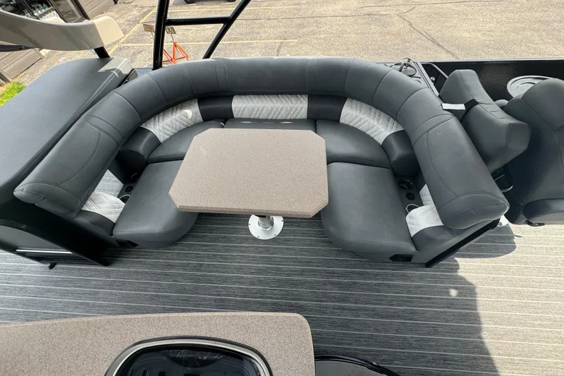 Slide: The Image of Luxurious seating area on 2026 Premier Escalante boat with modern design and table. - 13