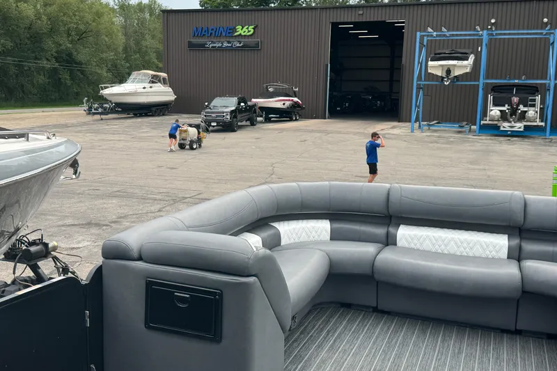 Slide: The Image of Outdoor boat dealership with Premier Escalante 2026 model, featuring luxury seating and various boats. - 20