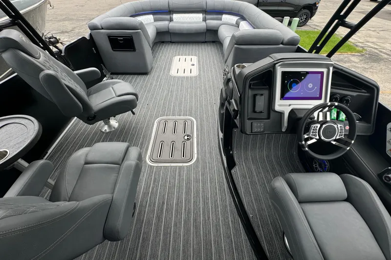 Slide: The Image of Luxurious interior of 2026 Premier Escalante pontoon boat with modern seating and dashboard. - 23