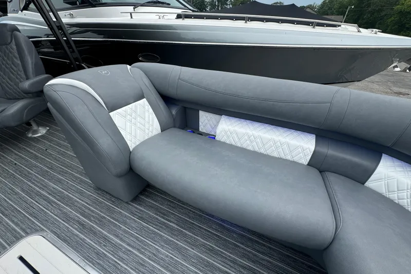 Slide: The Image of Luxurious seating on 2026 Premier Escalante boat with sleek gray and white upholstery. - 25