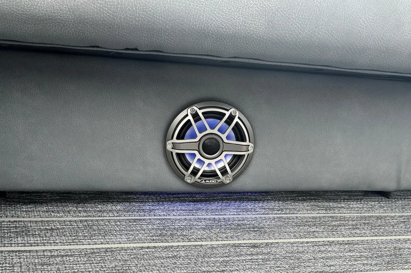 Slide: The Image of Speaker embedded in 2026 Premier Escalante's interior, featuring sleek design and blue lighting. - 29