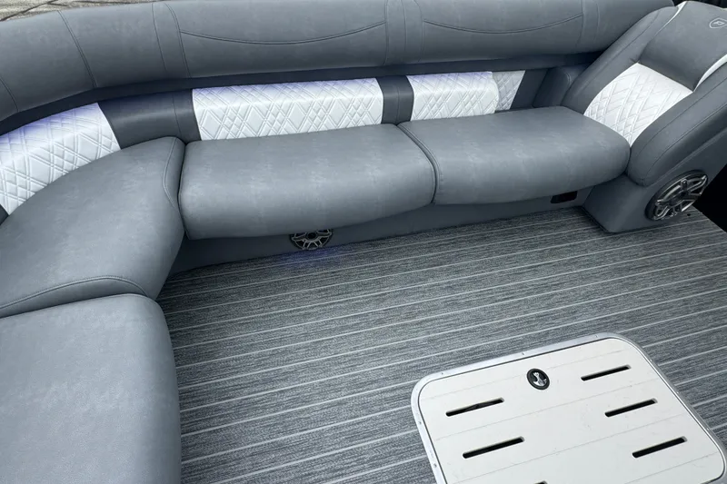 Slide: The Image of Luxurious seating in 2026 Premier Escalante boat with gray upholstery and striped flooring. - 30