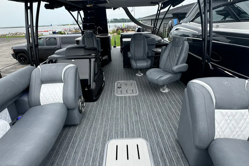 Slide: The Image of Luxurious interior of 2026 Premier Escalante pontoon boat with plush seating and modern design. - 31
