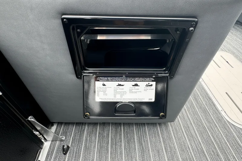 Slide: The Image of 2026 Premier Escalante interior with built-in waste disposal unit and safety instructions. - 34