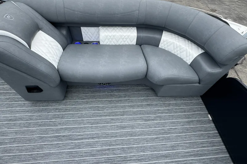 Slide: The Image of 2026 Premier Escalante boat interior with gray and white cushioned seating. - 39
