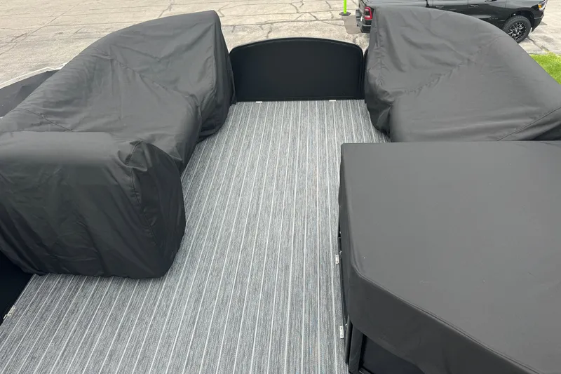 Slide: The Image of 2026 Premier Escalante interior with covered seating and striped flooring. - 43