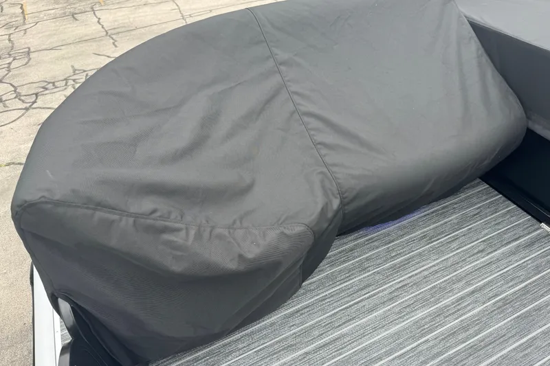 Slide: The Image of Covered seating area on 2026 Premier Escalante boat, featuring durable gray fabric. - 46