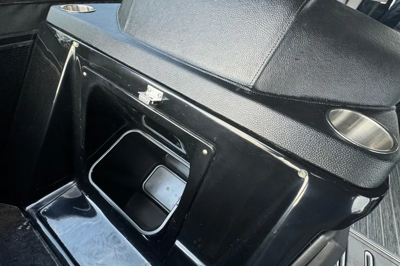 Slide: The Image of 2026 Premier Escalante interior with black leather and cup holders. - 5