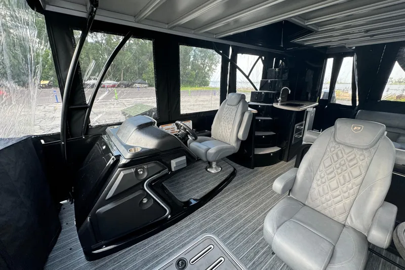 Slide: The Image of Luxurious interior of 2026 Premier Escalante boat with plush seating and modern helm. - 55