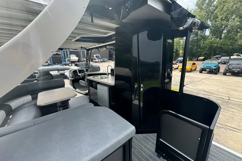 Slide: The Image of Interior of 2026 Premier Escalante pontoon boat with seating and kitchenette. - 8