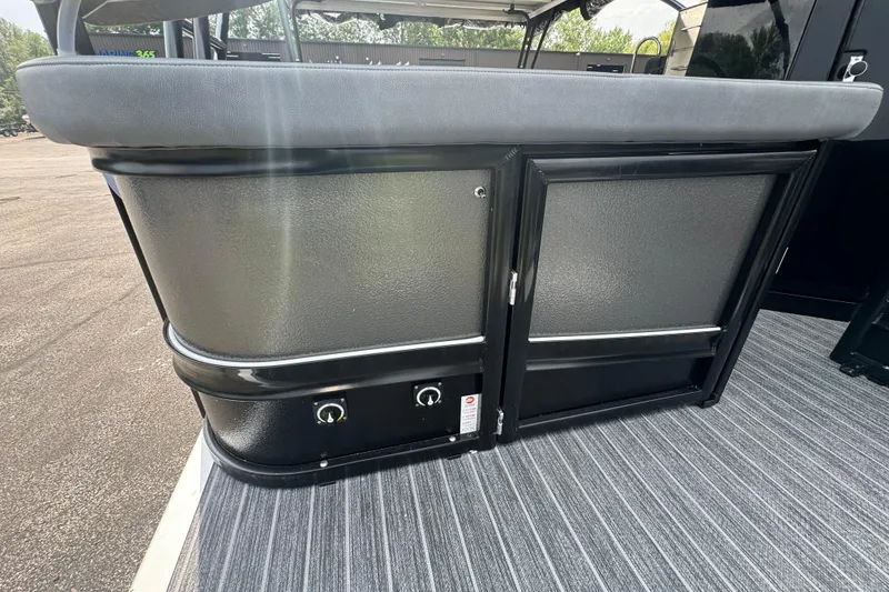 Slide: The Image of 2026 Premier Escalante boat interior with sleek black paneling and modern design. - 9