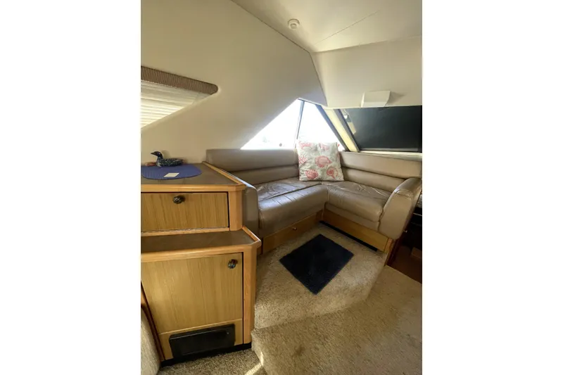 Slide: The Image of Interior of 2001 Bayliner 3988 Command Bridge Motoryacht with cozy seating area. - 12